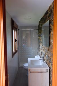 a bathroom with a sink and a toilet at El Cimblu in Gradura +52 photos