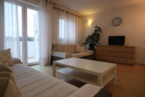 a living room with a couch and a coffee table at Piadora in Banjol