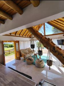 a living room with a couch and swings at Mirador in San Pedro