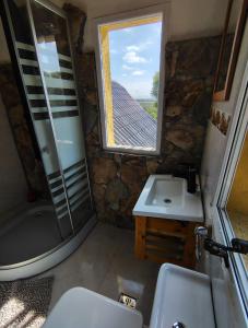 a bathroom with a shower and a sink and a window at Mirador in San Pedro +28 photos
