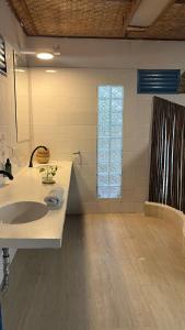 a bathroom with a sink and a shower at Bayside Island in Cartagena de Indias