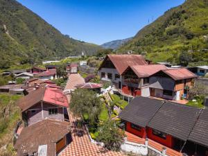 an overhead view of a village with houses and mountains at Hostería Agoyán Deluxe in Ulba