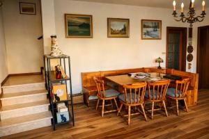 a dining room with a wooden table and chairs at Villa Alina Family Retreat in Pietrasanta