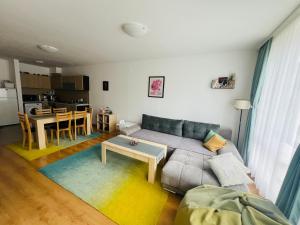 a living room with a couch and a table at Bansko Aspen Relax & Chill in Bansko