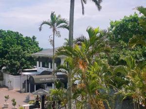 a house with palm trees in front of it at The Bay View Hotel in Richards Bay +28 photos