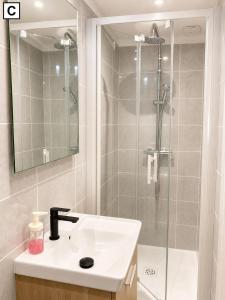 a bathroom with a sink and a shower at Notre Dame in Perpignan +42 photos