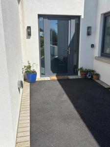 a door leading into a house with a driveway at Beyren House Guest Suite in Emo