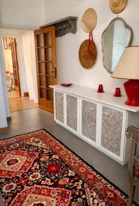 a living room with a rug on the floor at Guest House A Due Passi in Olbia