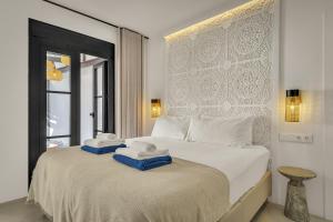 a bedroom with a bed with towels on it at Casa Azalia - Marbella Old Town by Finest Rentals in Marbella +46 photos