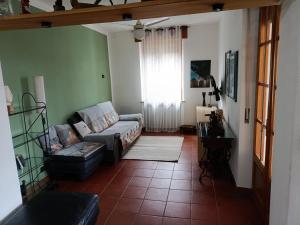 a living room with a couch and a window at B&B La Casetta in Gattinara