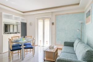 a living room with a couch and a table at Casa Norb Lerici - with Private Parking in Lerici +35 photos