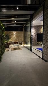 a living room with a couch and a table at Villa 22 in Ajman 