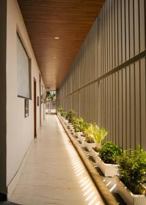 a hallway with plants on the side of a building at Hotel Chhaya in Rishīkesh
