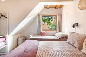 a bedroom with two beds and a window at Complejo Ermitazh in Valle Grande