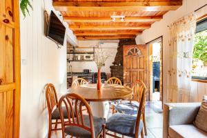 a dining room with a table and chairs at Complejo Ermitazh in Valle Grande +75 photos
