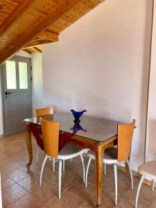 a dining room with a table and chairs at Samos Panorama Hills in Pythagoreio
