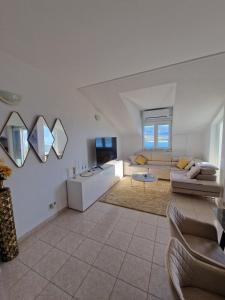 a living room with a couch and a table at Compass Apartment in Trogir