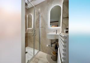 a bathroom with a shower and a sink at L'olivier du vieil Antibes in Antibes