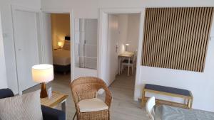 a living room with a couch and a table and chairs at Beach House Adria in Bibinje