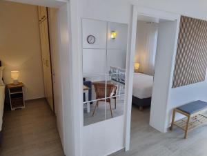 a room with a bedroom with a bed and a mirror at Beach House Adria in Bibinje +28 photos