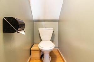 a bathroom with a toilet and a paper dispenser at Chalet Les Angles in Les Angles +46 photos