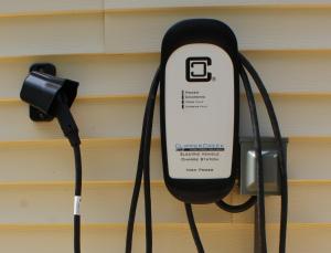 a cell phone hooked up to a charger at Beach Hoppers' Hideaway in Cape Charles