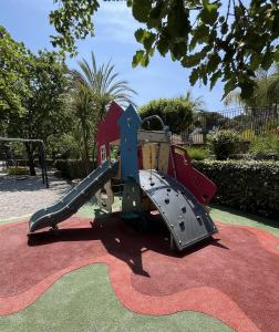 a playground with a slide on a rug at Luxe 6 persoons Chalet camping Leï Suves Cote d'Azur Roquebrune-sur argens in Roquebrune-sur-Argens
