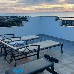 a room with two beds on top of a building at Villa Milka in Utjeha