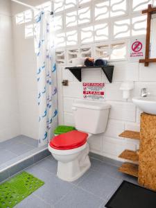 a bathroom with a toilet and a sink at Antara del Mar in San Bernardo del Viento