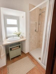 a bathroom with a sink and a shower at IN THE HILLS NEAR THE LAKE, Relax e Comfort in Grotte di Castro