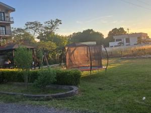 a playground with a swing in a yard at Apartmani Moco in Ulcinj +1 photo
