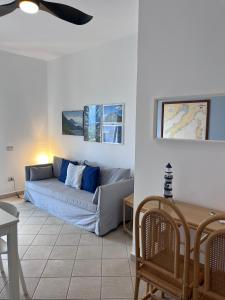 a living room with a couch and a table at Il Casalino in Maratea