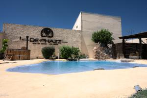 a large swimming pool in front of a building at DePhazz I Wellness Clinic & Spa in Junín