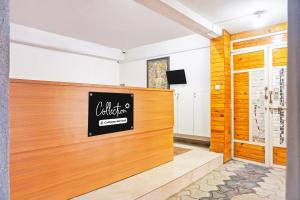 a waiting room with a sign on the wall at Super Collection O Baner Formerly Seven Hills in Pune