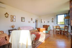 a living room with a couch and a table at Villa Cristani in Pedemonte +177 photos