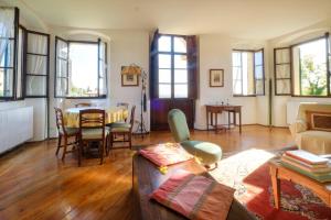 a living room with a couch and a table at Villa Cristani in Pedemonte