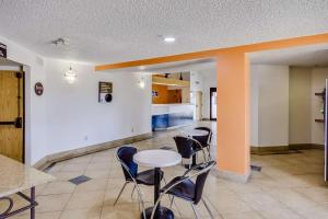 a room with a table and chairs in a building at Motel 6-Katy, TX - Houston in Katy