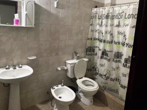 a bathroom with a toilet and a sink at Depto Clarita in Belén