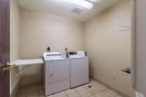 a small bathroom with a sink and a toilet at Motel 6-Huron, OH - Sandusky in Huron