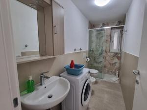 a bathroom with a sink and a toilet and a mirror at Villa Eugenia in Tropea +47 photos