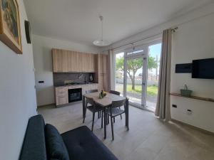 a living room with a table and a dining room at Villa Eugenia in Tropea