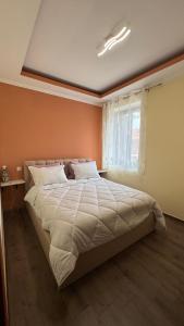 a bedroom with a large bed in a room at Αρχοντικό Κάτω Βρύση in Levidi