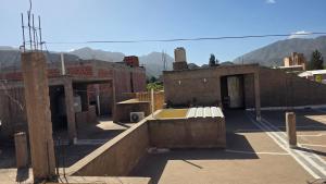 a building under construction with mountains in the background at Depto Clarita in Belén