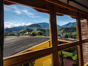 a window view of the mountains from a house at Villa Luz Hotel in Silvia +24 photos