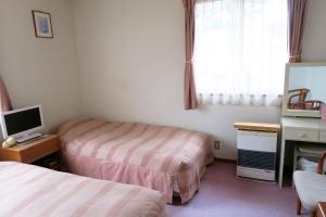 Postel nebo postele na pokoji v ubytování Pension Agi