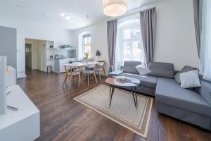 a living room with a couch and a table at Alte Schule Reichenau an der Rax in Reichenau