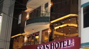 a dress hotel sign in front of a building at Eras Hotel in Chiclayo