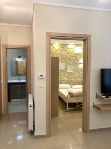 a room with a door leading to a bedroom at Thalassa in Siviri