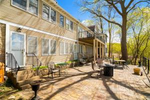 a house with a brick patio next to a building at St. Croix Valley Inn in Shafer