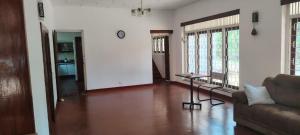 a living room with a couch and a table at Deepthi Villa in Nikawatawana